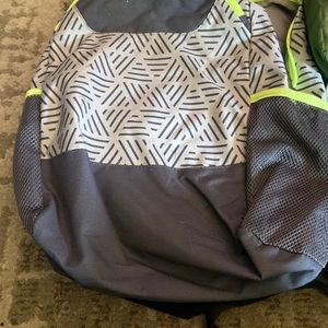 Grey kids backpack small stain on shoulder strap